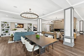 A modern dining room with a large table and chairs at The Leo Myrtle Beach, Myrtle Beach, SC